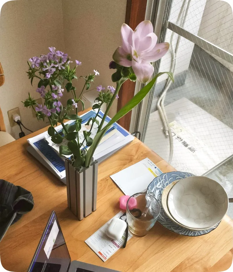 Type 660 vase on a table with purple flowers