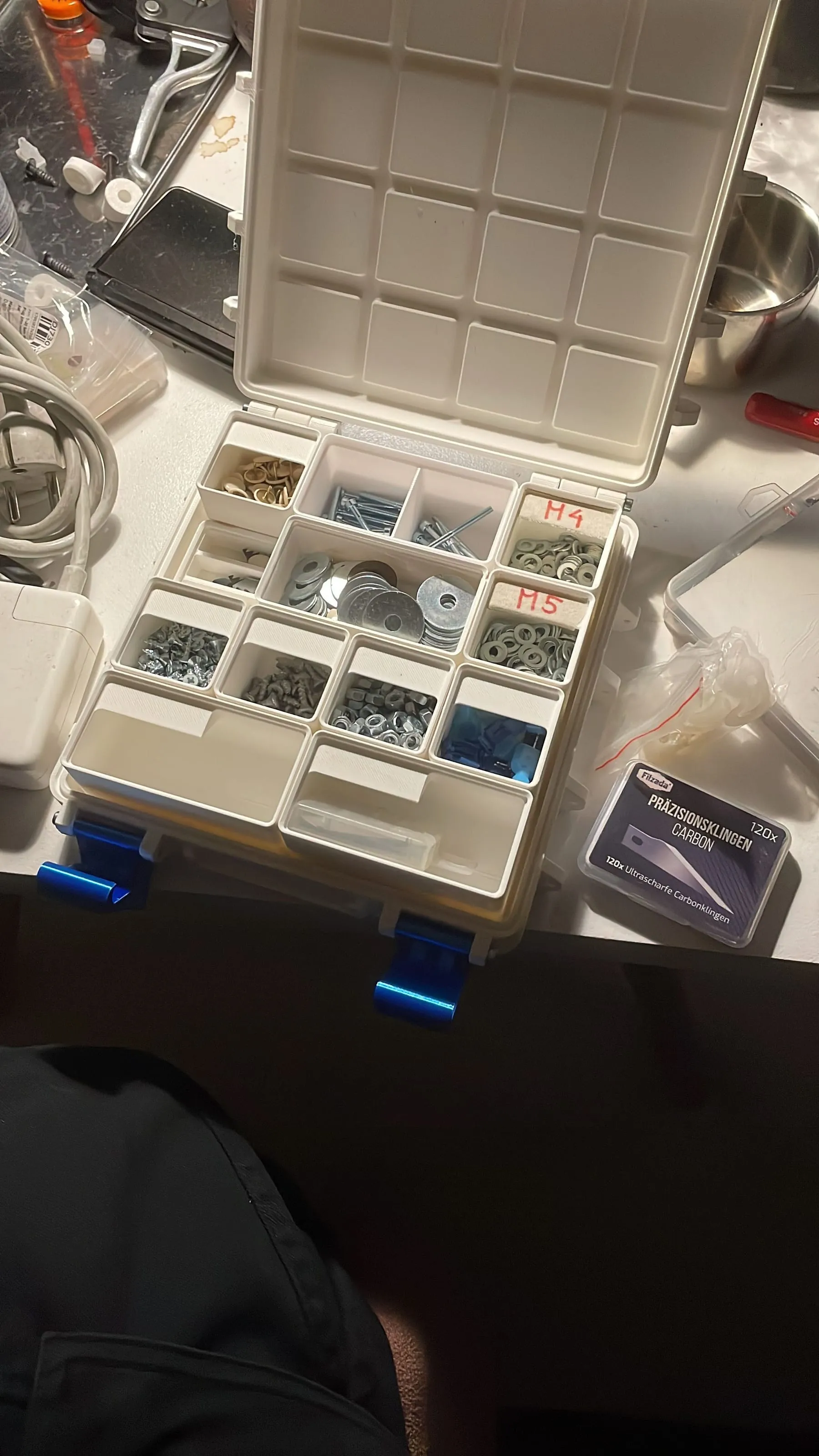 Box of sorted 3D printed parts and fasteners, Analogue store Zeedijk